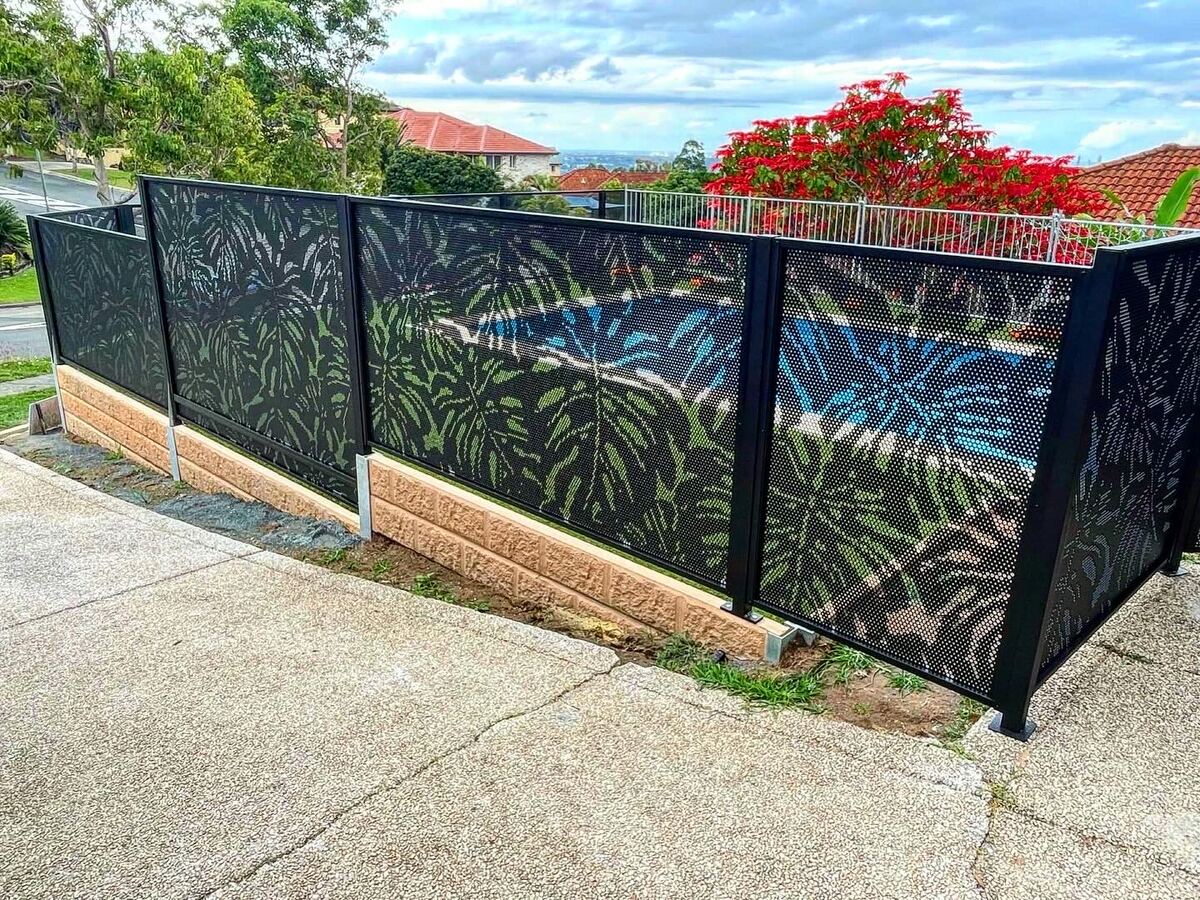 Monstera design pool fencing in Textured Black beside flowering bougainvillea, Queensland