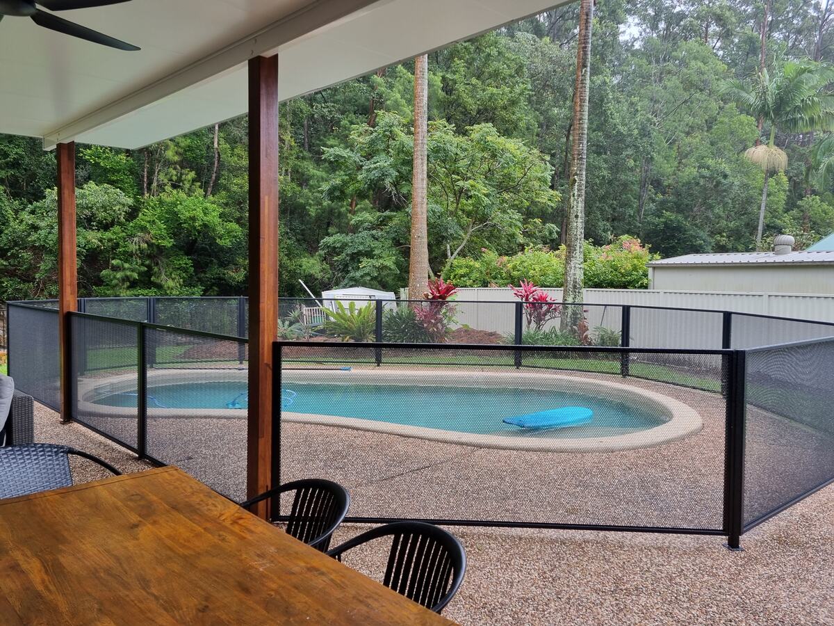 Pure Perf fencing around a round spa under a patio, Queensland