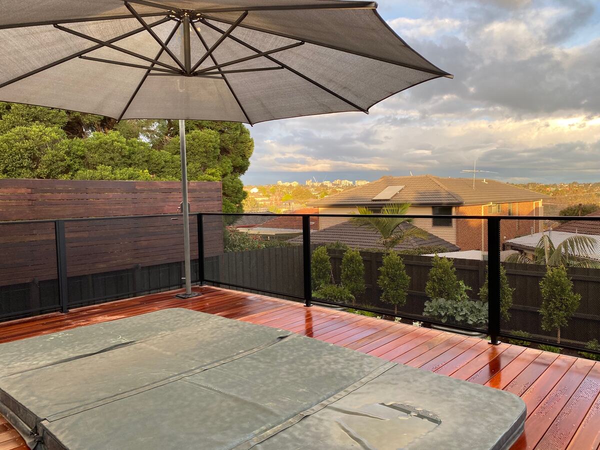 Pure Perf fencing around a deck spa with a view, Queensland