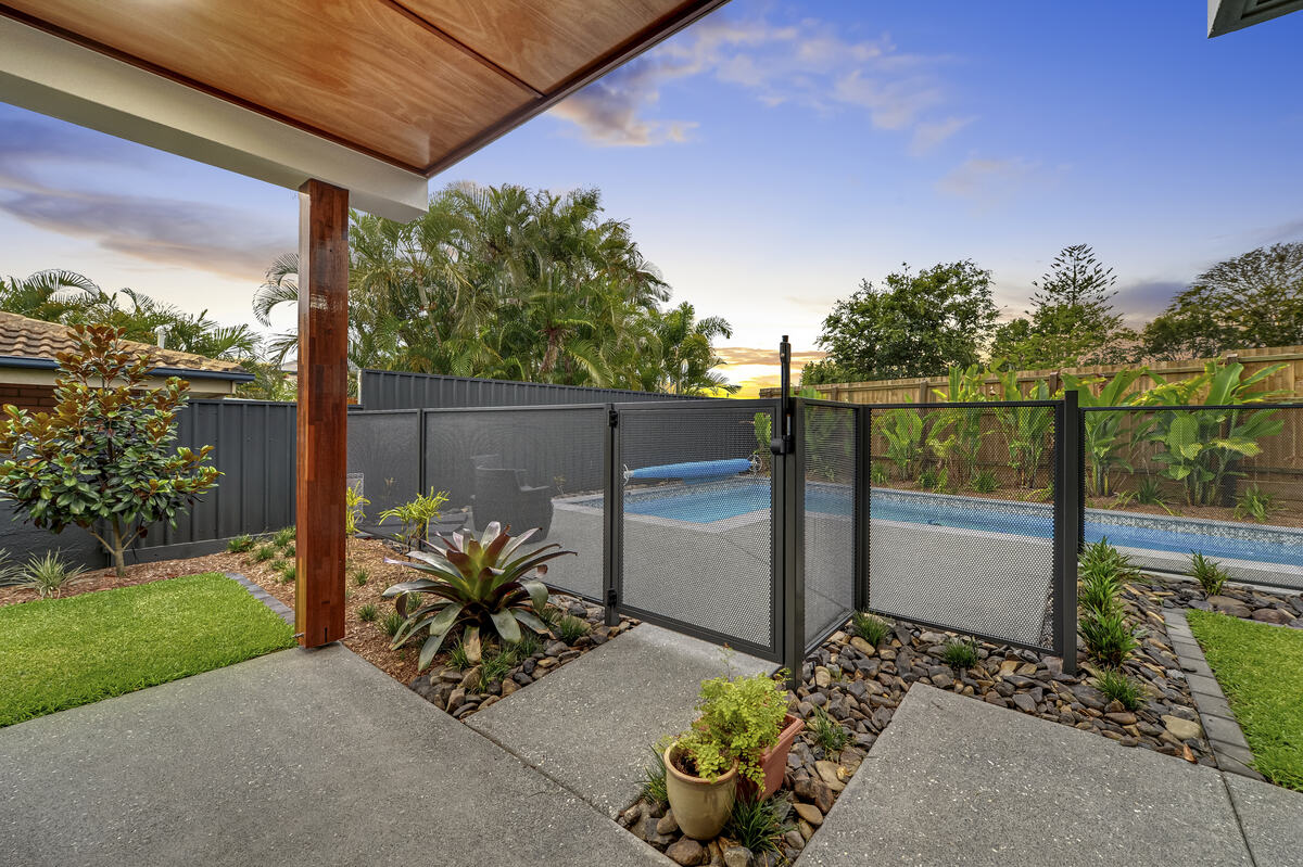 Pure Perf pool fence and gate in Textured Monument at sunset, Queensland